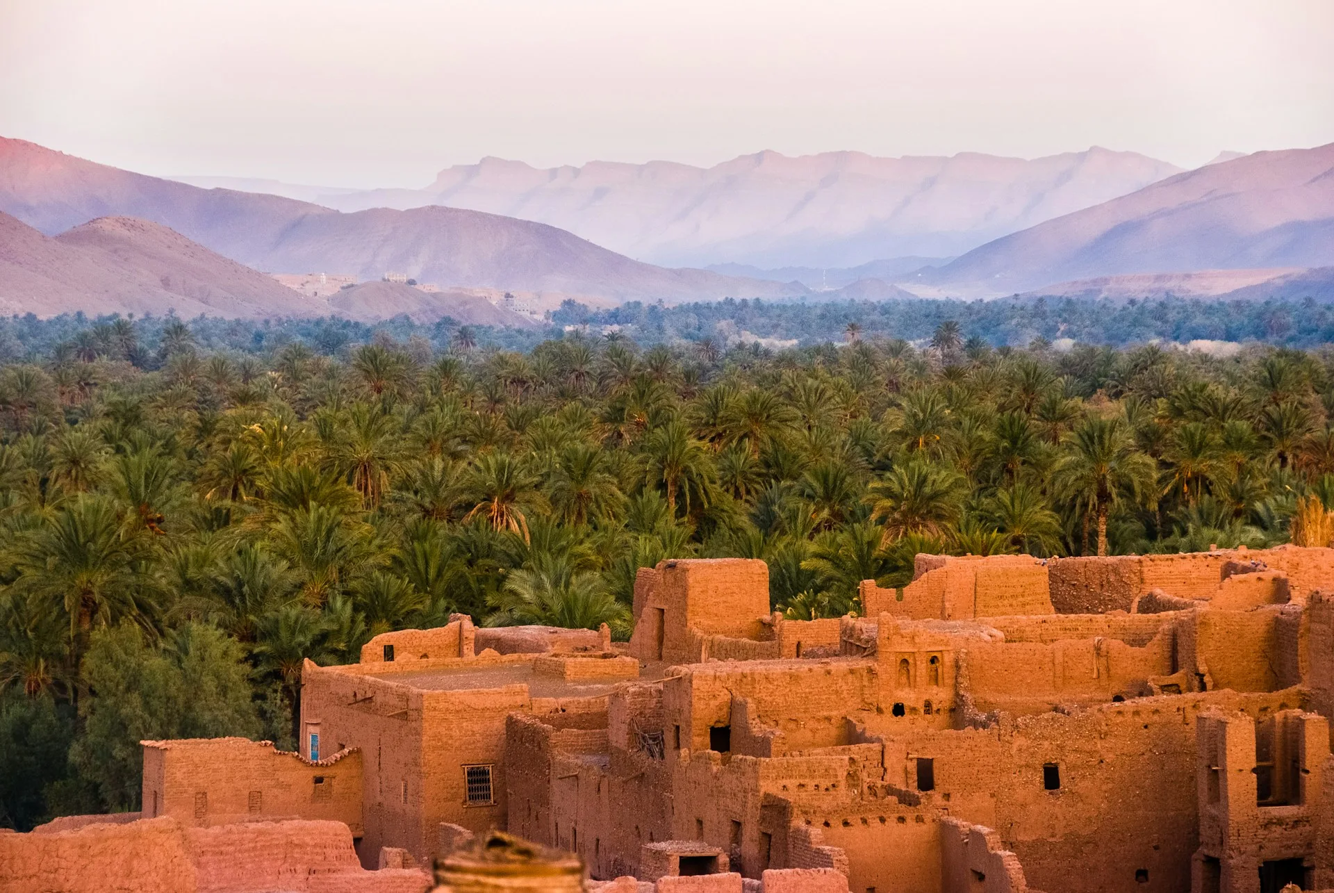 Earth-built kasbah and palm grove in the Dades Valley